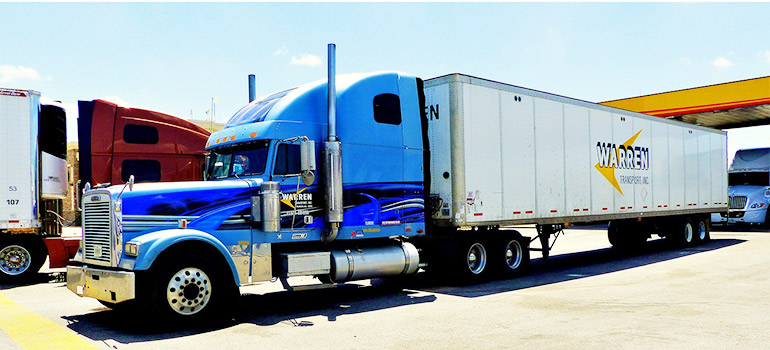 blue truck on a parking lot