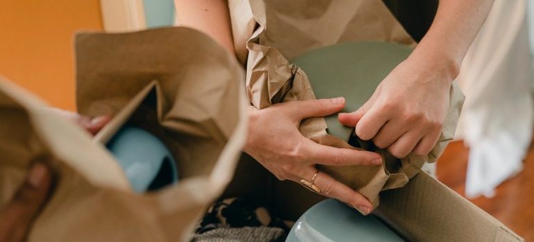 a person packing items before the move