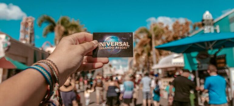 a person holding a universal studios card