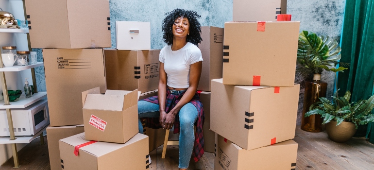 beautiful black woman in the middle of relocation preparations
