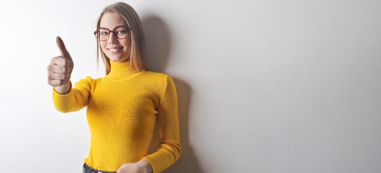 happy woman in yellow turtle neck shirt 