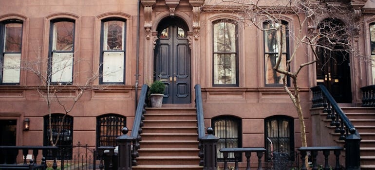 A brownstone building is one of the challenges that people can face when moving locally in NYC.