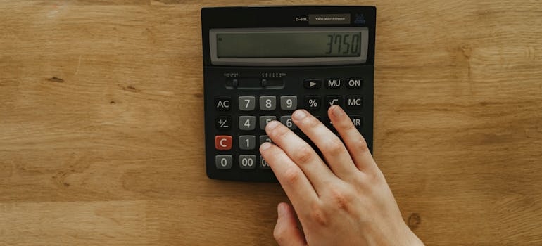A person using a calculator.